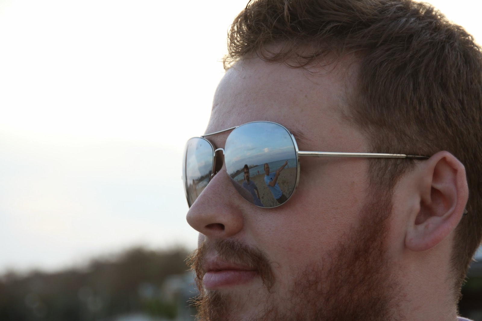 Portrait of Euan Reid wearing aviator sunglasses